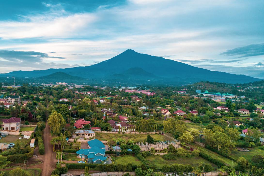 An aerial shot of Arusha with Kilimanjaro in the background Arusha, Tanzania showing beautiful architecture amidst the natural greenbelt